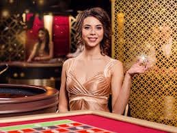 JILI game interface on mobile phone showing interactive gameplay and live dealer stream side by side